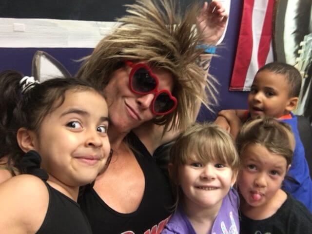 Playful group of kids with fun hairstyles at our music daycare in Owings Mills