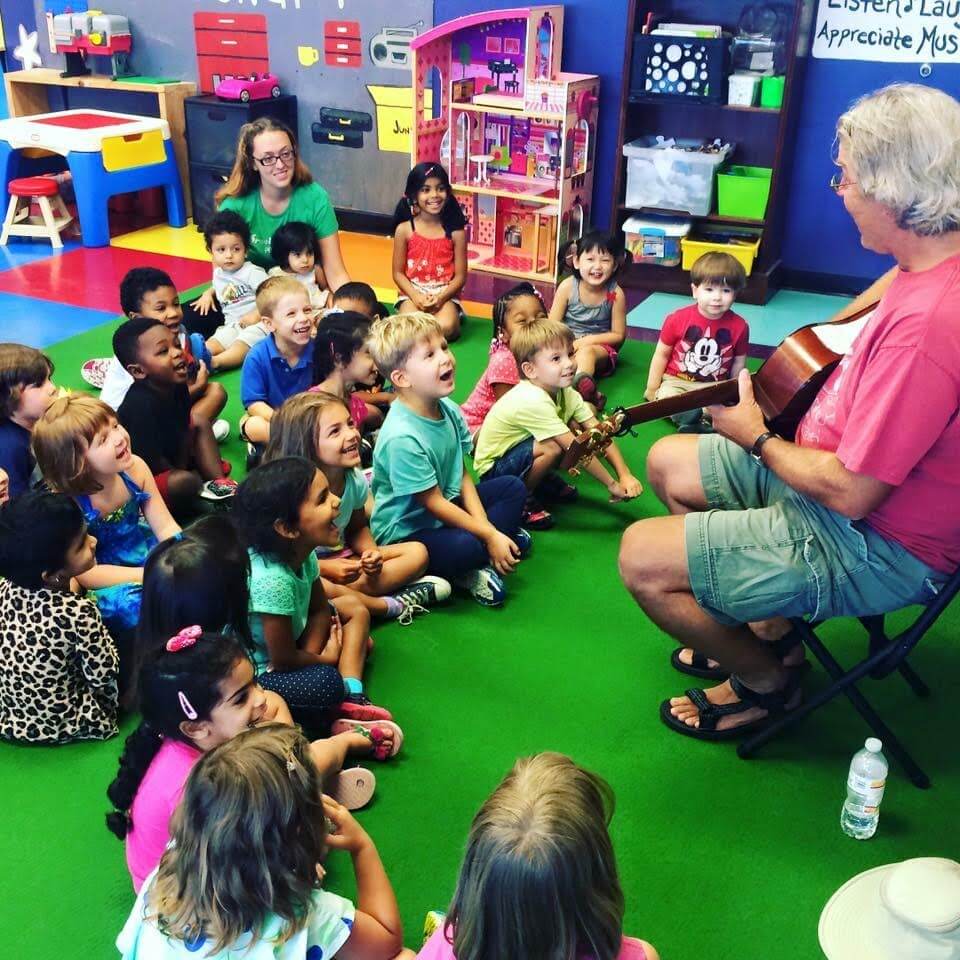 Children enjoying a music lesson together