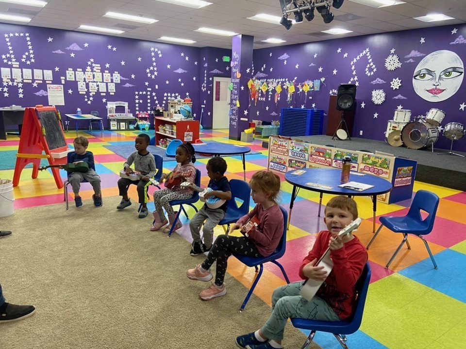 Kids playing ukuleles at our music preschool in Owings Mills