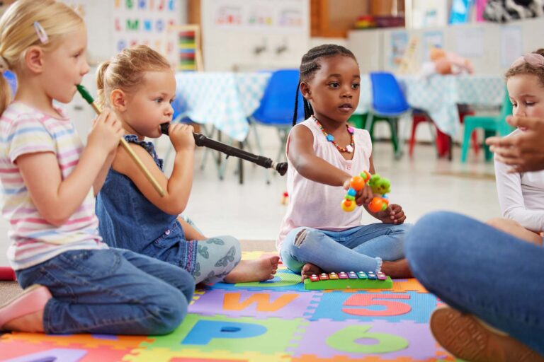 Children playing musical instruments in a classroom at a childcare center in owings mills.
