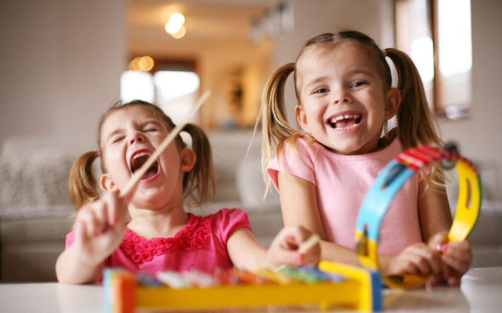 2 preschool girl Language development through music